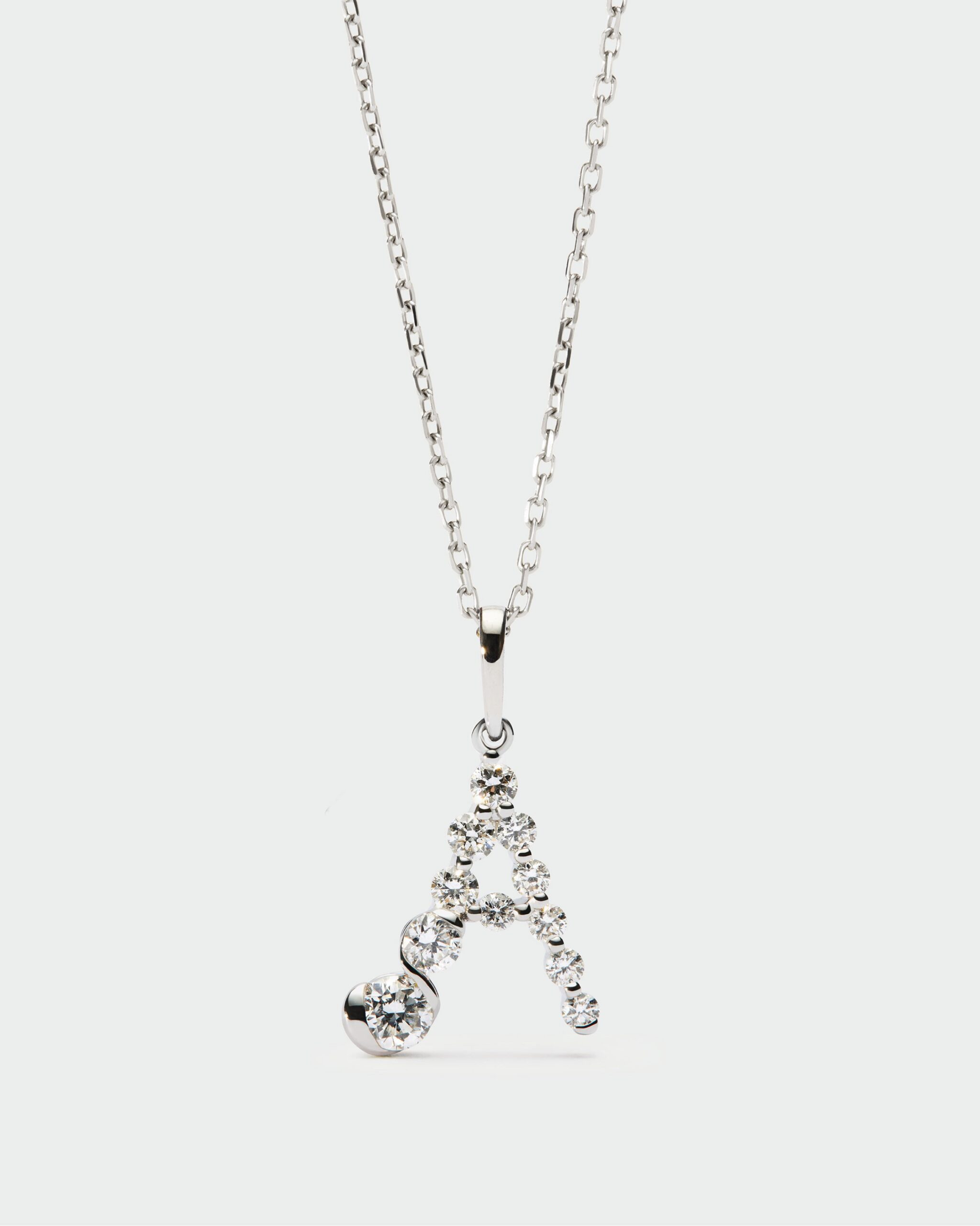 Diamonds and white gold Initial pendant