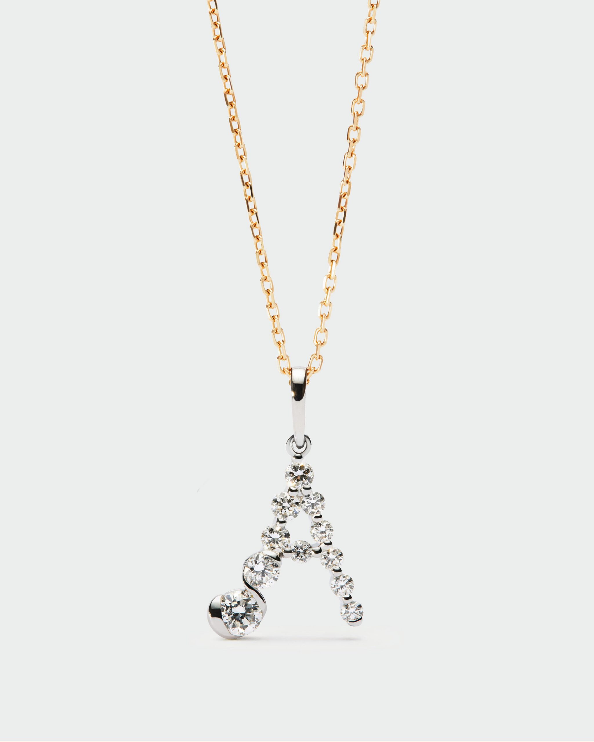 Diamonds and white gold Initial pendant