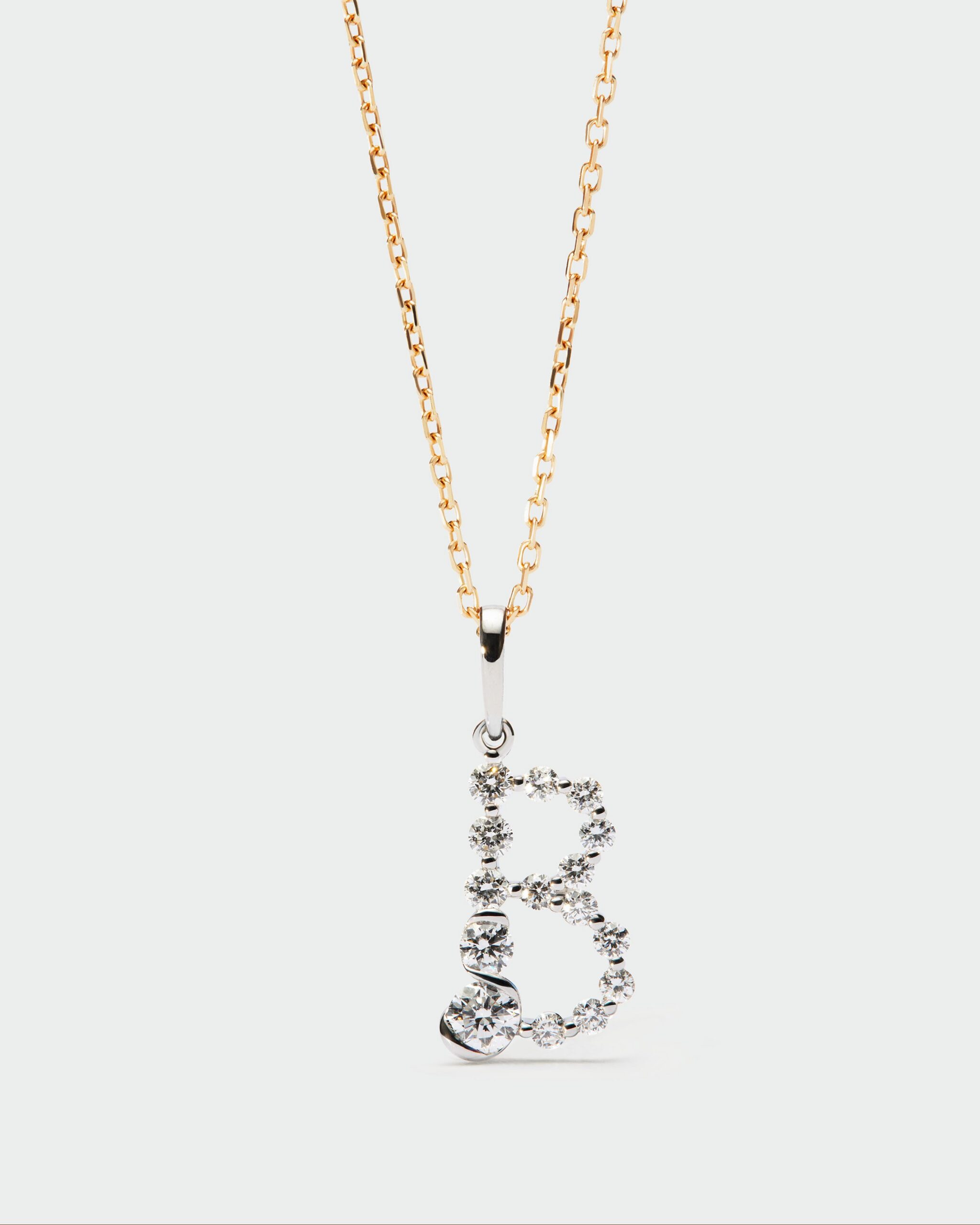 Diamonds and white gold Initial pendant