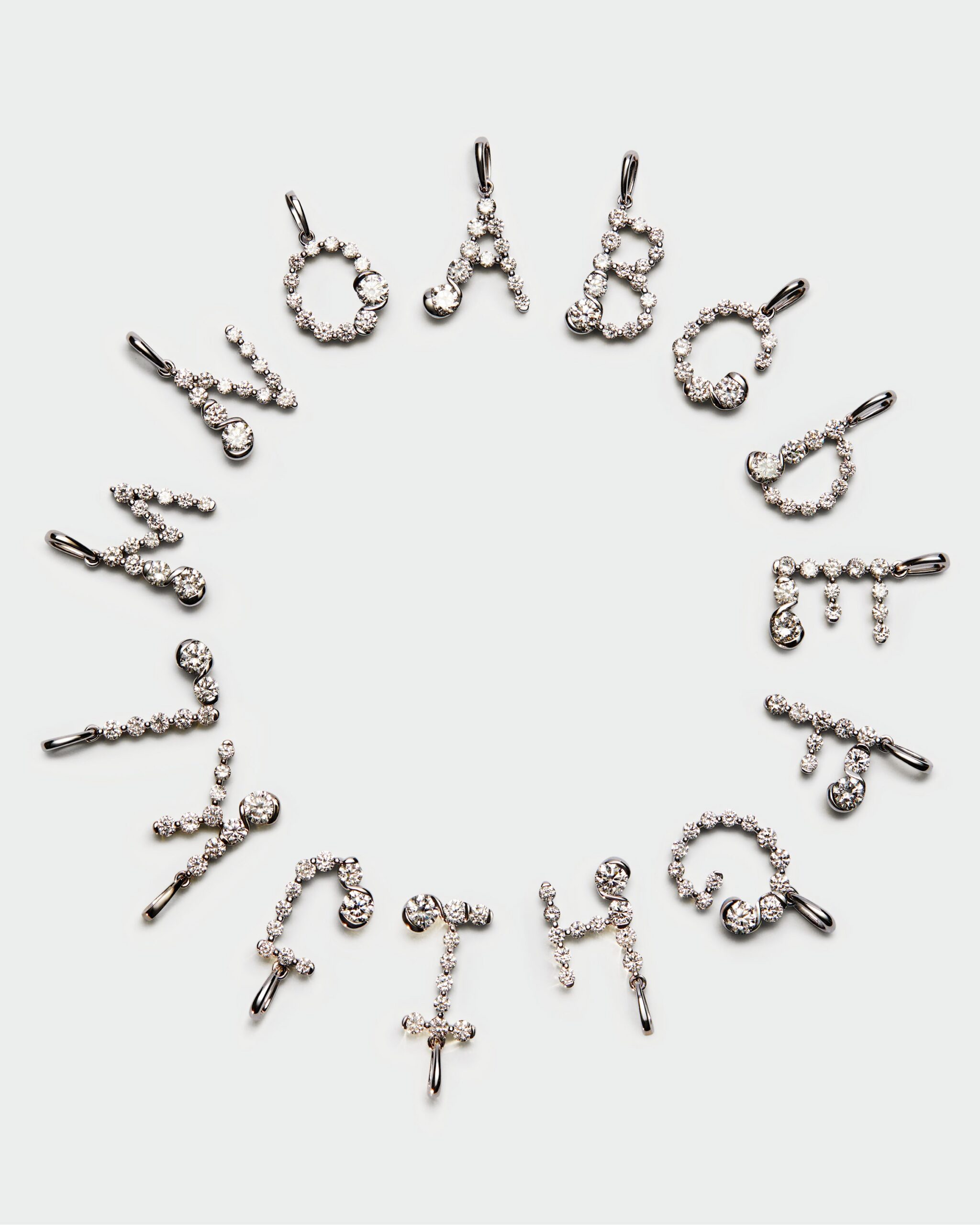 Diamonds and white gold Initial pendant