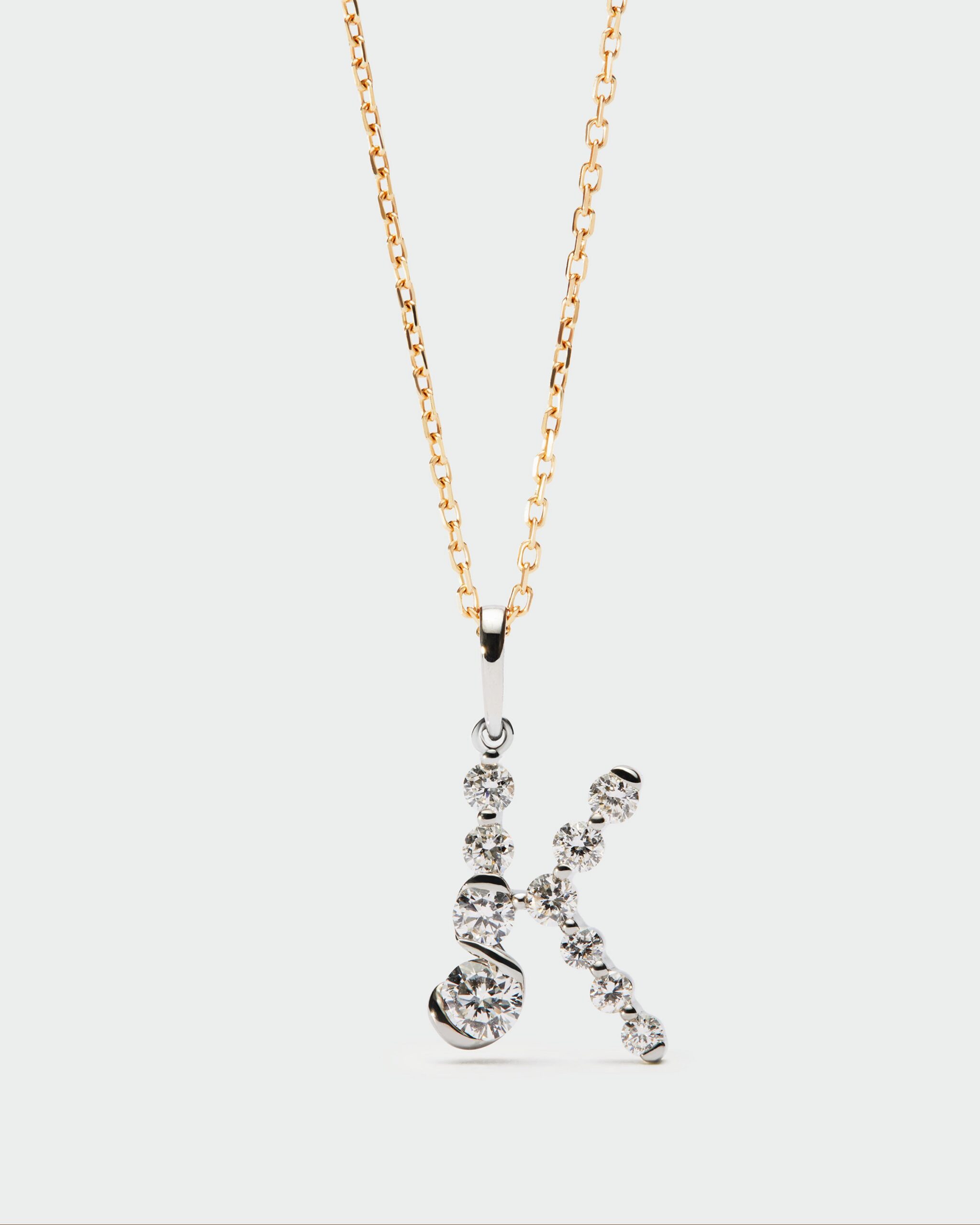 Diamonds and white gold Initial pendant