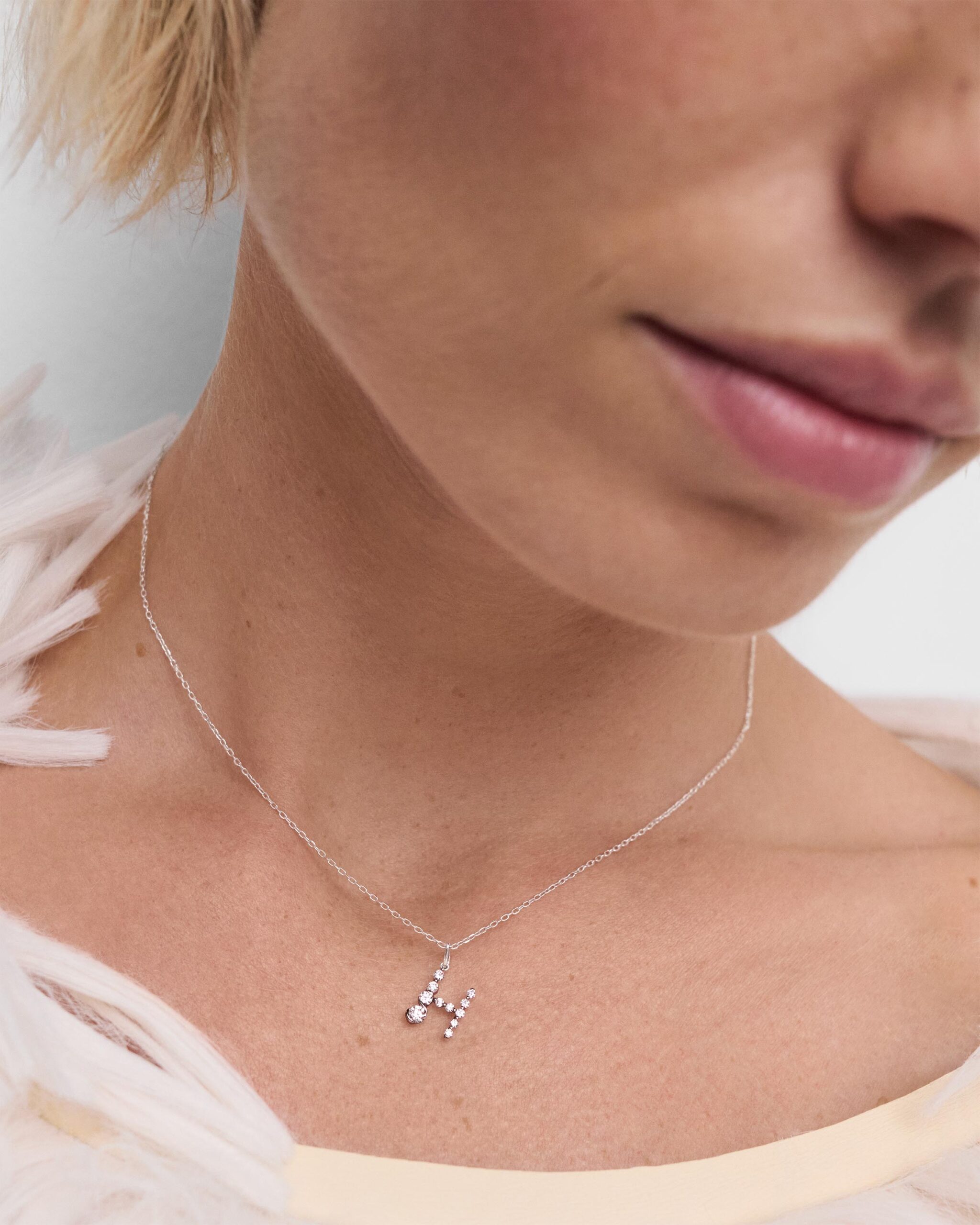 Diamonds and white gold Initial pendant