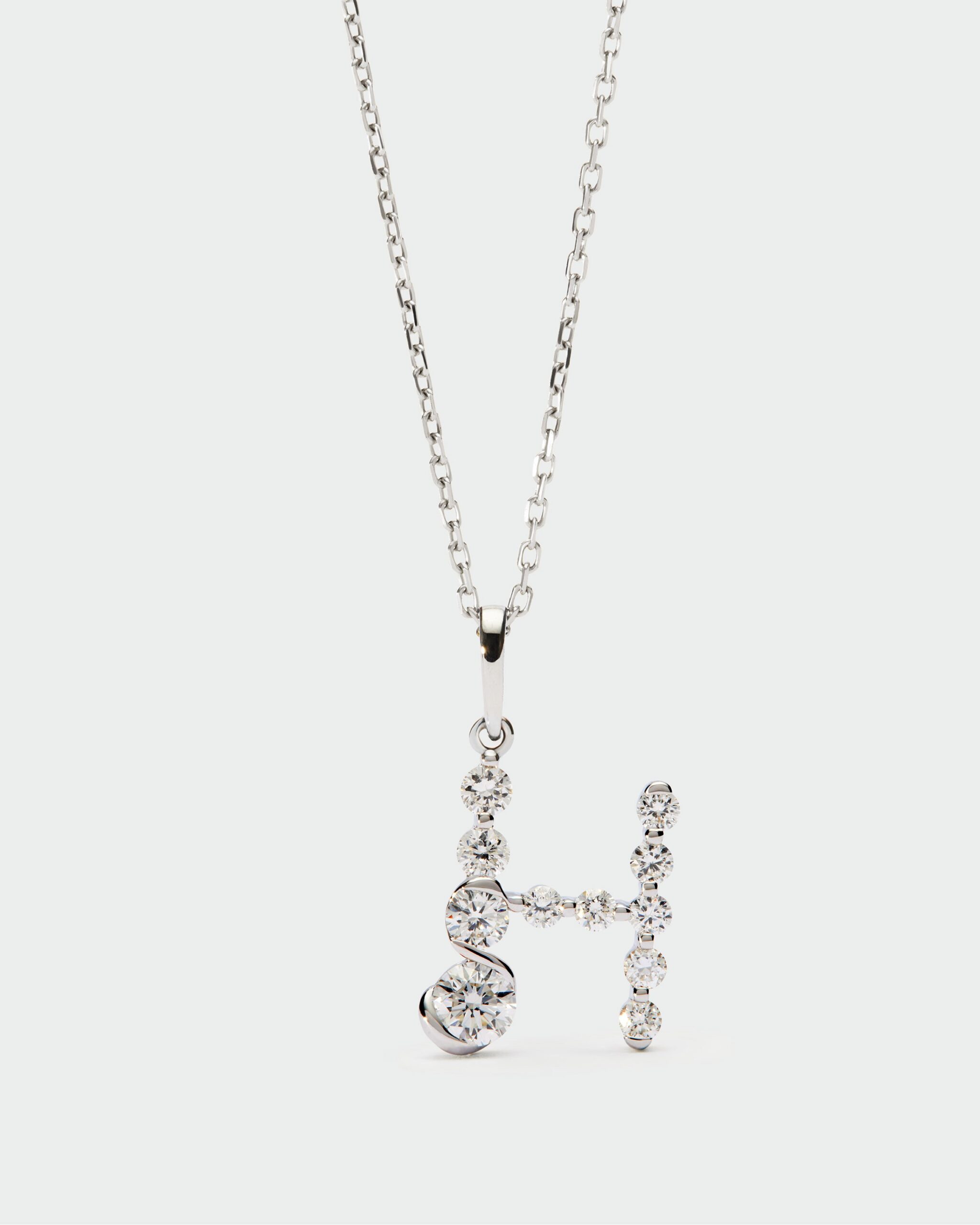 Diamonds and white gold Initial pendant