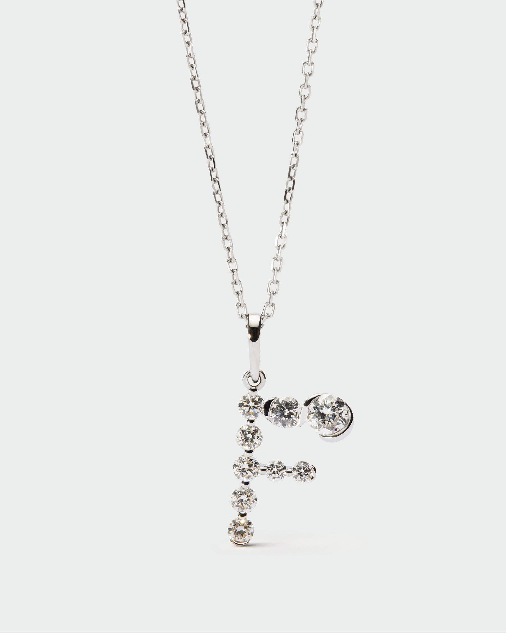 Diamonds and white gold Initial pendant
