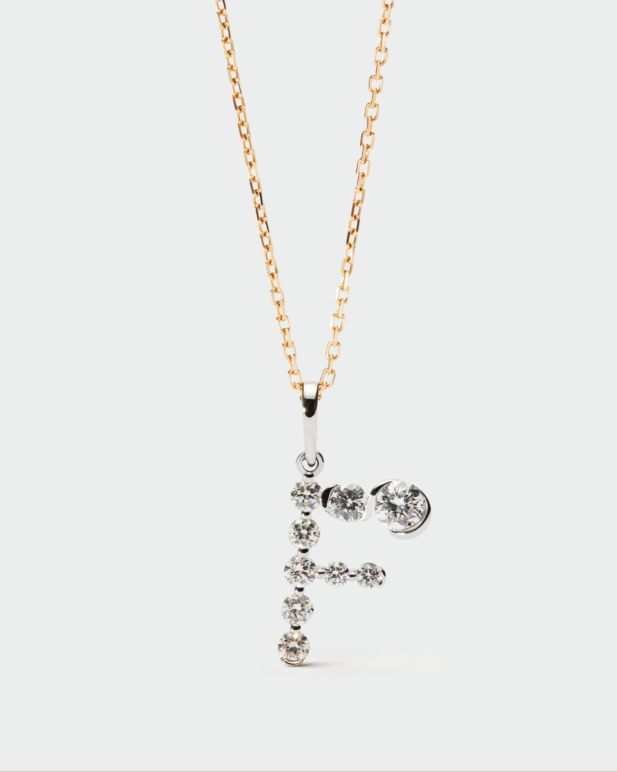 Diamonds and white gold Initial pendant