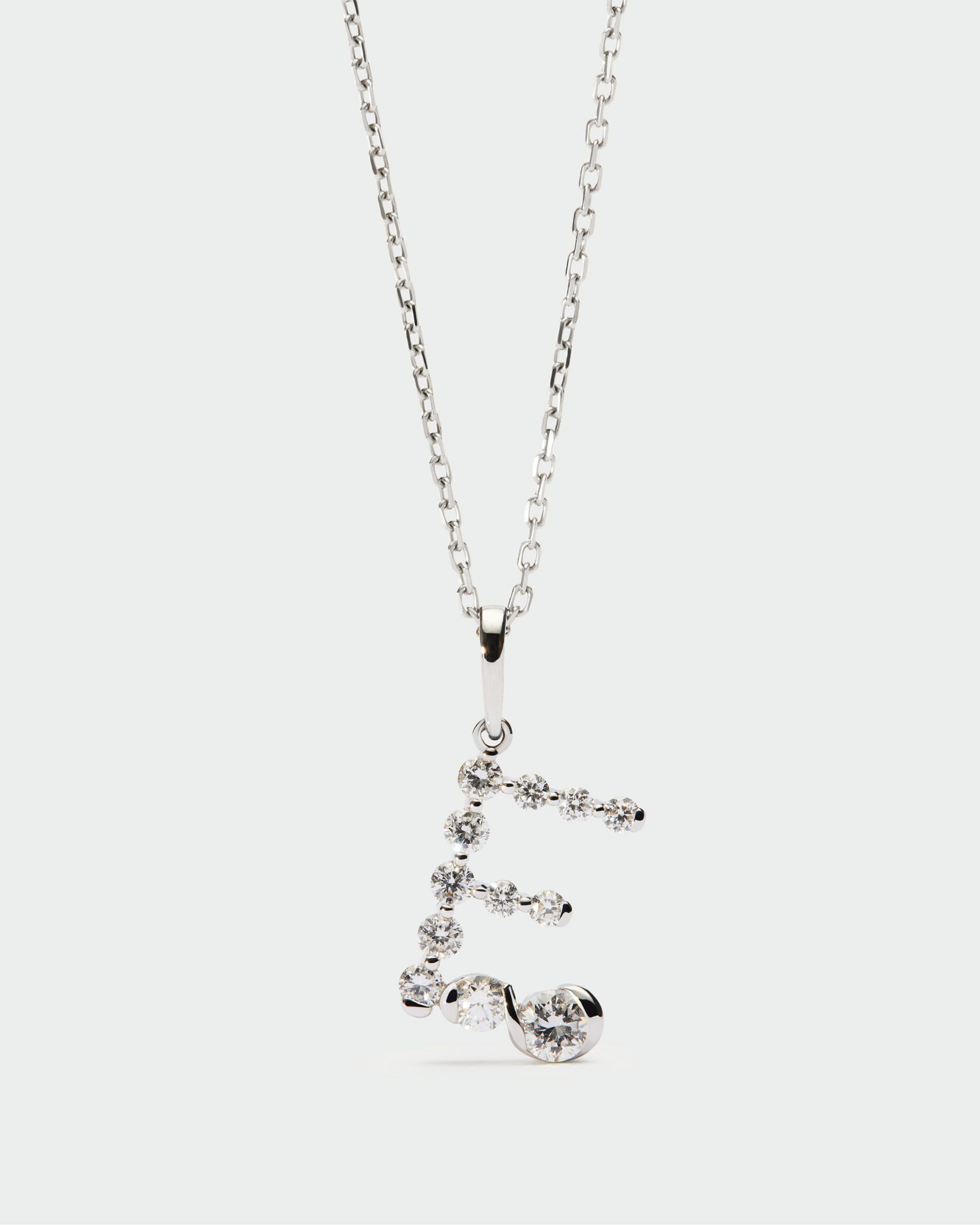 Diamonds and white gold Initial pendant