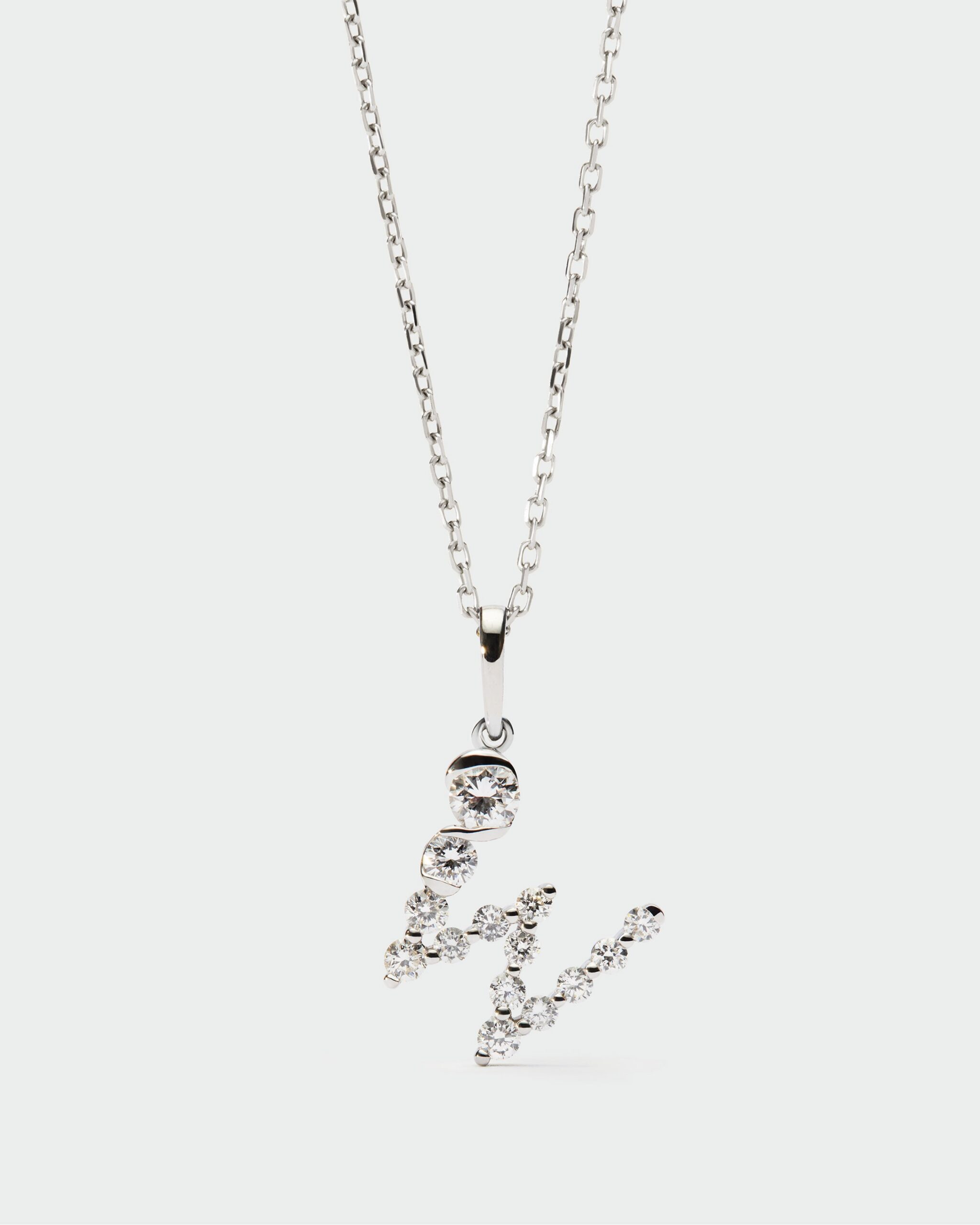 Diamonds and white gold Initial pendant
