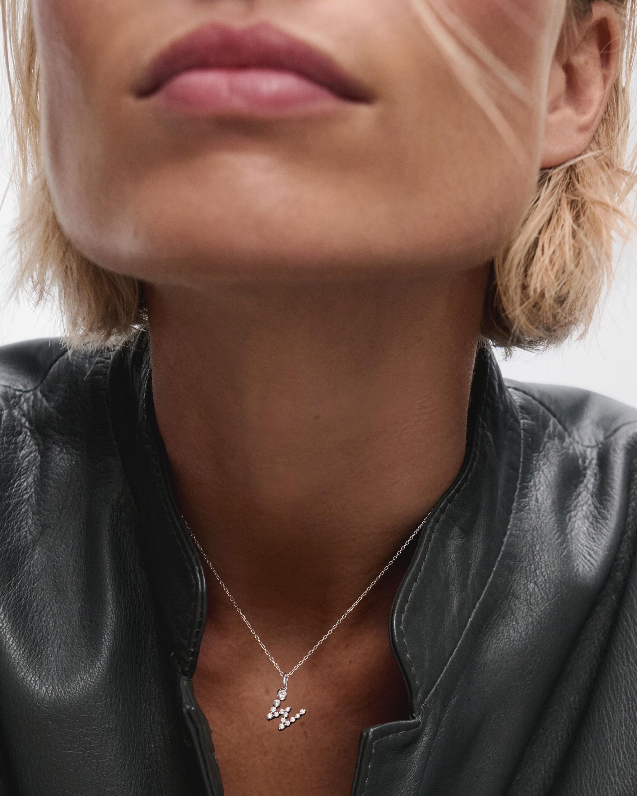 Diamonds and white gold Initial pendant