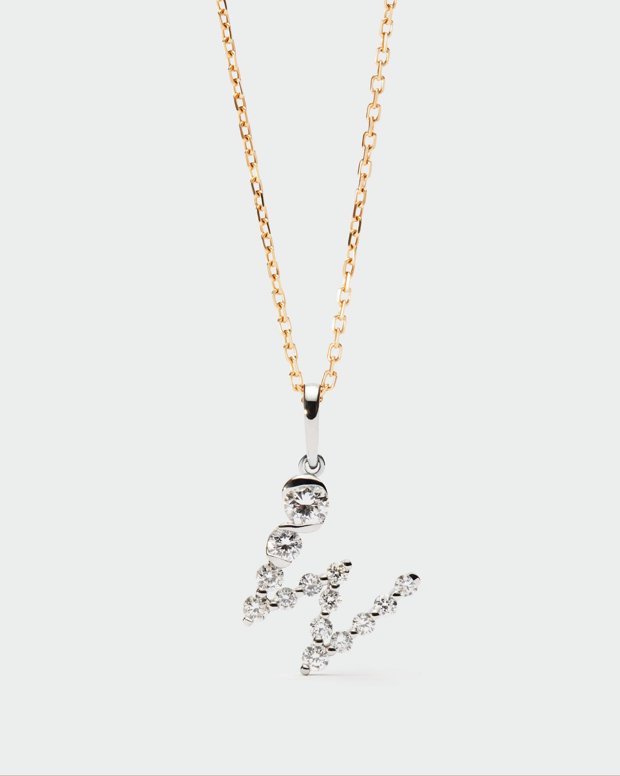 Diamonds and white gold Initial pendant